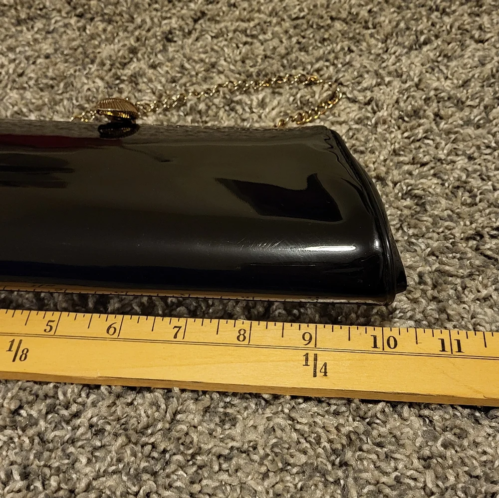 Elegant Black Clutch Bag with gold-tone hinged clasp and gold chain